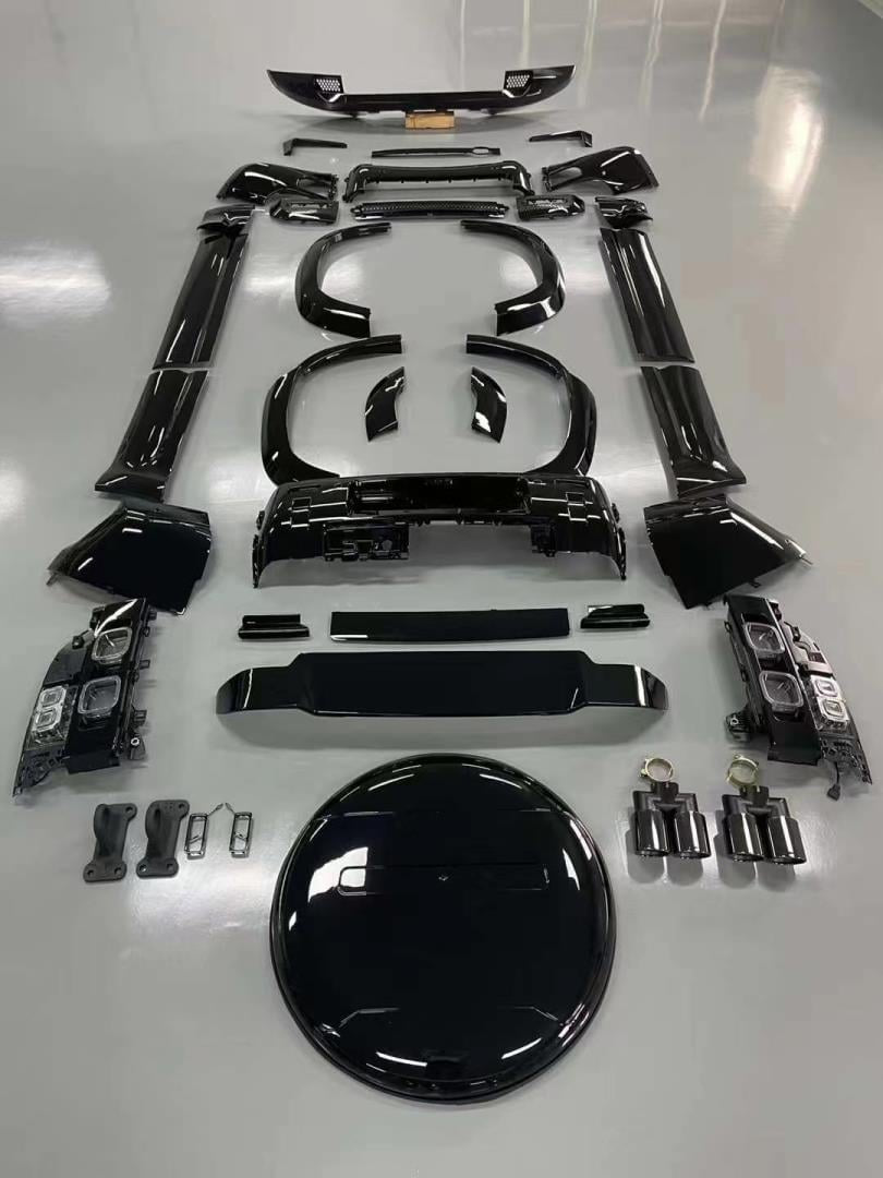 photo of all the defender 110 body kit parts laid out across the floor for an easy visualization
