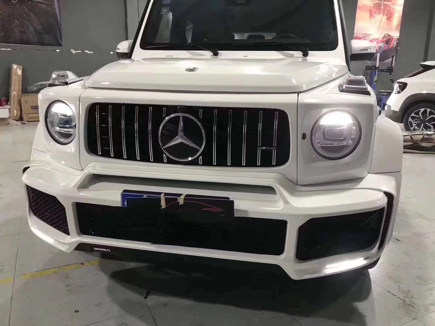 White Mercedes-Benz SUV in an autoshop