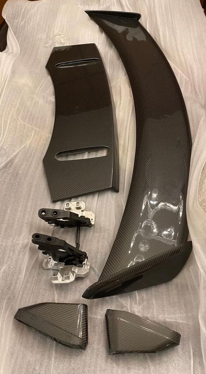 active spoiler for jaguar f type with parts laid out on a white package wrap
