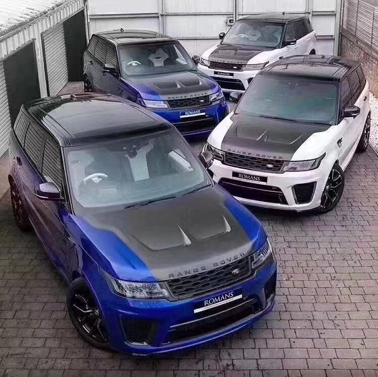 Three Range Rover Sport vehicles with custom bonnet hoods. One is blue, one is white, and one is black with silver detailing.