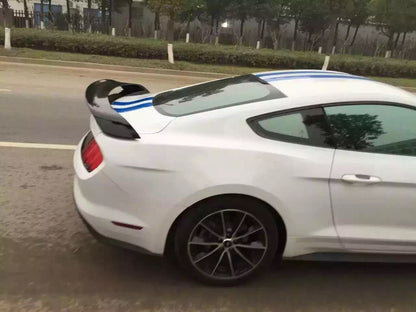 Side view white Mustang with spoiler